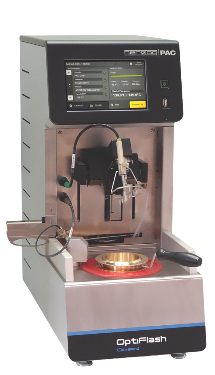 Laboratory device called OptiFlash with a digital screen displaying settings, metallic base, and testing compartment. Modern, precise, technical tool. OptiFlash Cleveland Open Cup.