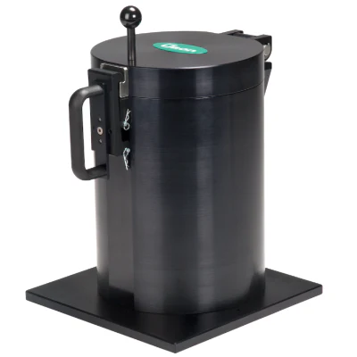 A black cylindrical device with a handle and lever on a square base.