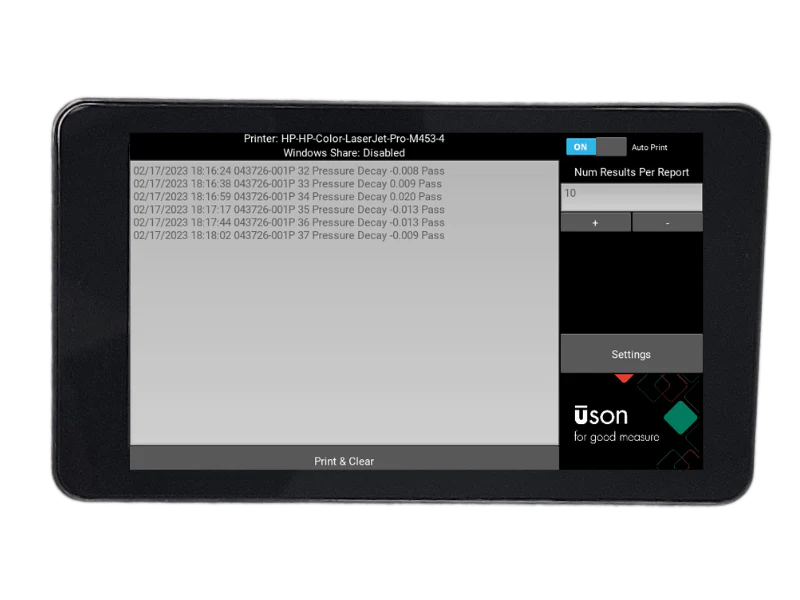 A black tablet displays a gray screen with technical data and settings.