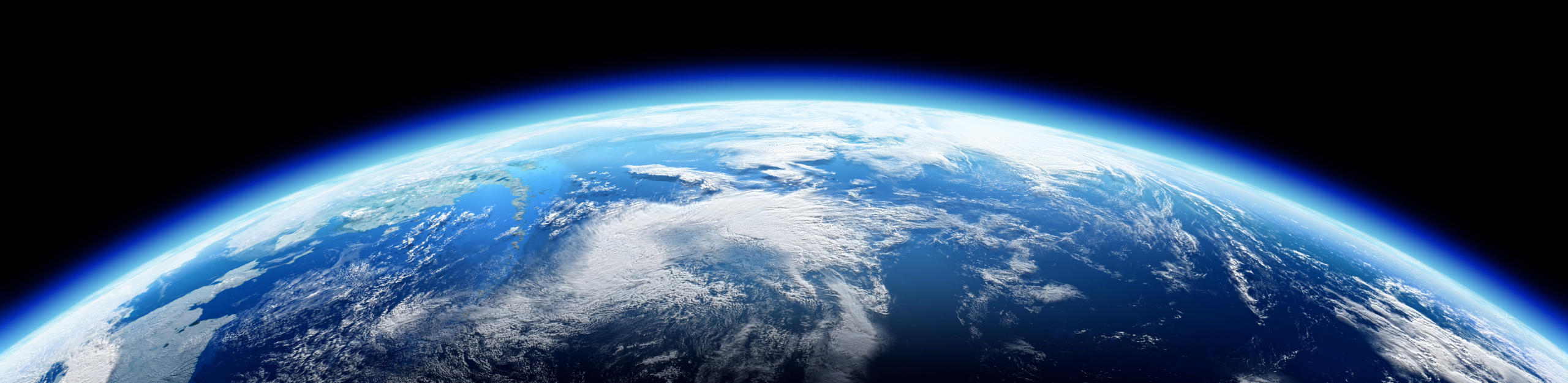View of Earth from space, showing a blue, cloudy atmosphere against the vast blackness of space. The horizon conveys a serene and majestic tone.