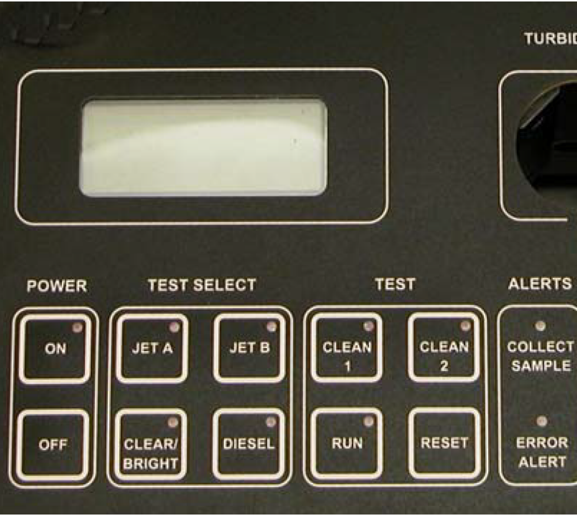 Close-up of an Emcee model 1140 Micro-Separometer control panel with buttons labeled for power, test selection, and alerts. Includes buttons for Jet A, Jet B, diesel, and error alerts.