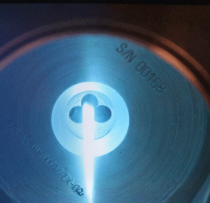 A close-up of a metallic surface marked with 