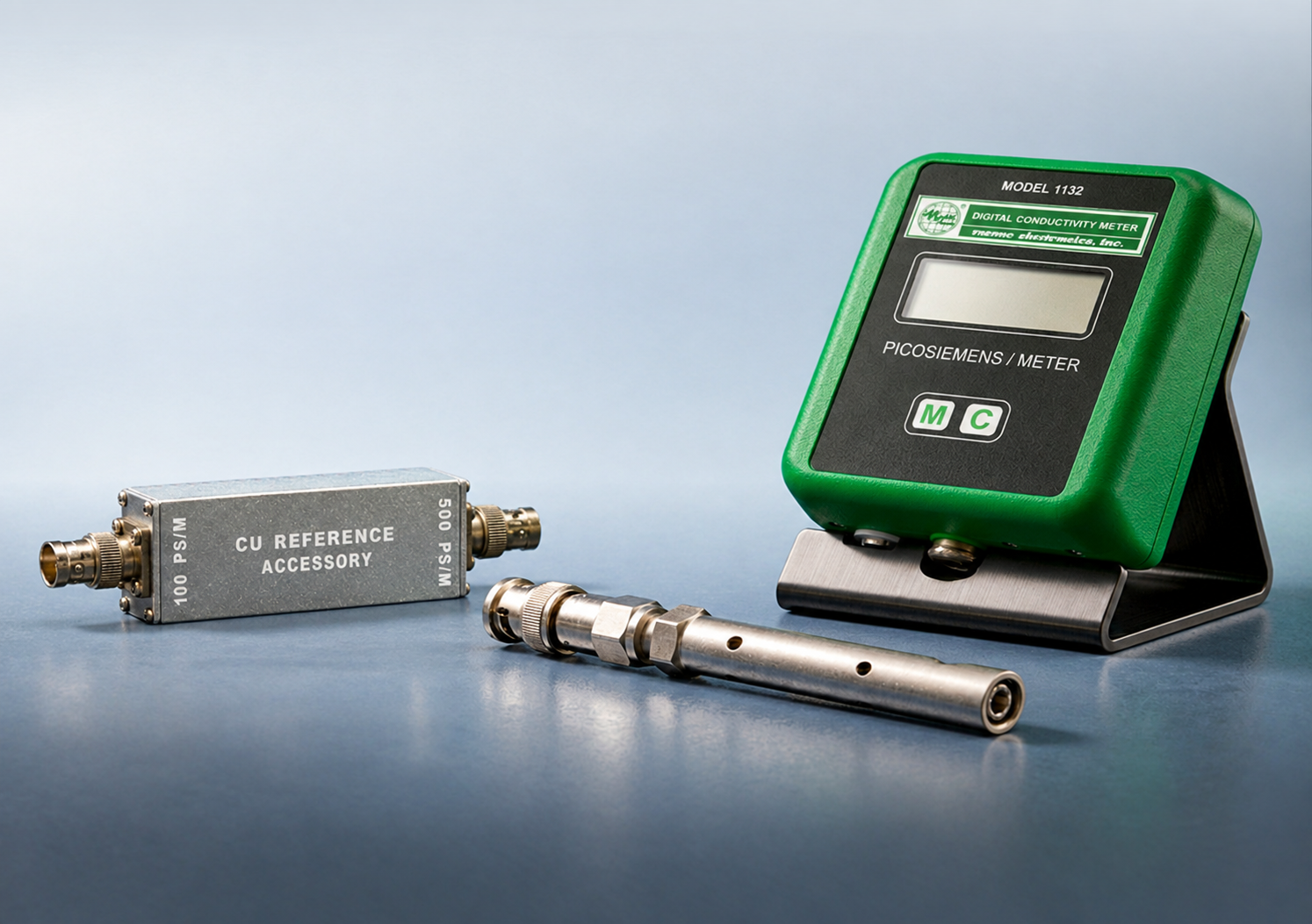 Digital conductivity meter displaying readings next to a metal pipe and Emcee Conductivity Unit CU.